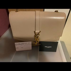 Ysl authentic cream /nude hand bag good condition.